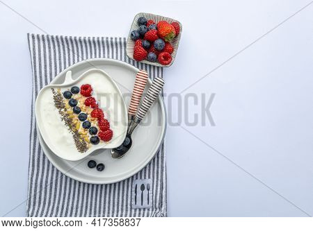 Fresh Yogurt With Fruits, Granola, Chia Seeds Und Napkin