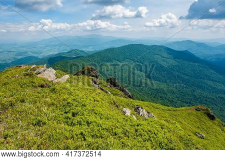 View From Pikui Mountain. Huge Stones On The Grassy Slopes. Summer Landscape Of Carpathian Mountains