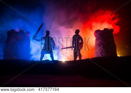 Medieval Battle Scene. Silhouettes Of Figures As Separate Objects, Fight Between Warriors At Night.