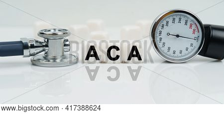 Medicine Concept. On A Reflective White Surface Lies A Stethoscope And Cubes With The Inscription - 