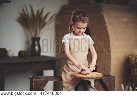 Charming Craftsman Little Girl Enjoying Pottery Art And Producti