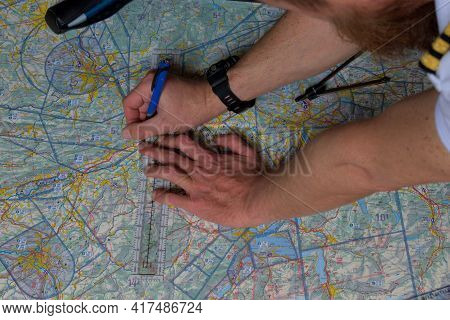 Pilot Is Calculating His Navigation Route On An Actual Map 25.3.2021