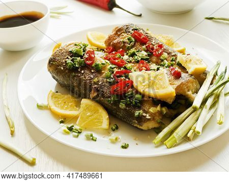 Baked Hake Fish With Herbs And Spices, Soy Sauce. Shallow Dof.