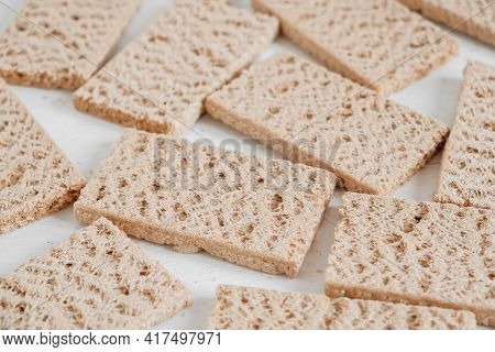 Rye Crisp Bread On A White Wooden Background. Top View. Copy, Empty Space For Text