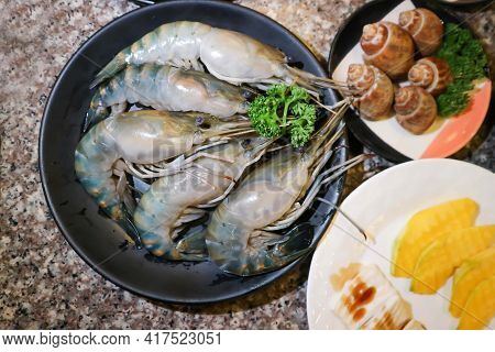 Raw Prawn, Raw Shrimp And Spotted Babylon Or Babylonia Areolata Or Shell For Cook