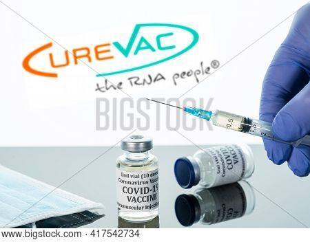 Morgantown, Wv - 19 April 2021: Small Bottle Of Coronavirus Vaccine With Syringe With Background Of 