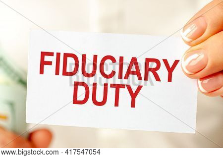 Dollars Bill, White Notepad Sheet On The White Background. Fiduciary Duty Text. Finance And Economic