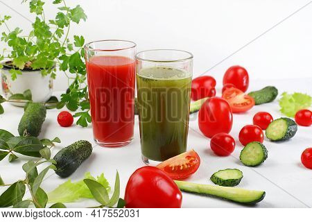 Detox Diet And Weight Loss Concept, Tomato Juice, Cucumber Smoothie And Ingredients On A Bright Tabl