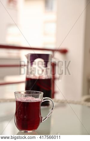 Hibiscus In A Glass Glass Against The Background Of A Jug On The Balcony, Alanya, April, 2021