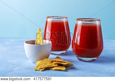 Traditional Mexican Cuisine: Nachos, Corn Tortilla Chips With Spicy Sauce And Alcoholic Drink Michel