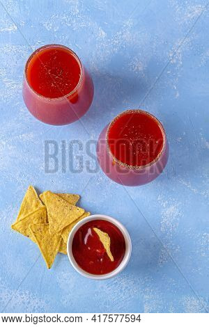 Traditional Mexican Cuisine: Nachos, Corn Tortilla Chips With Spicy Sauce And Alcoholic Drink Michel