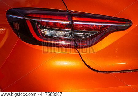 Orange Car Taillights. Exterior Detail. Close Up Detail On One Of The Led Taillights Modern Car.