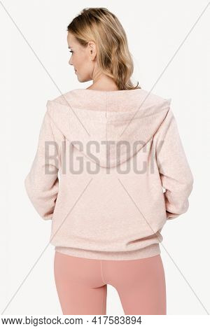 Beautiful woman wearing pink co-ord sportswear rear view