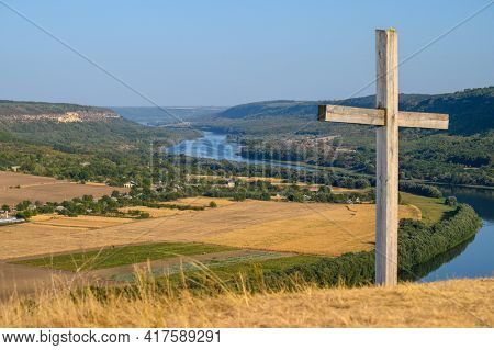 Cross at the top of hill and view to the Dniester river near Socola village, Soldanesti district, Moldova