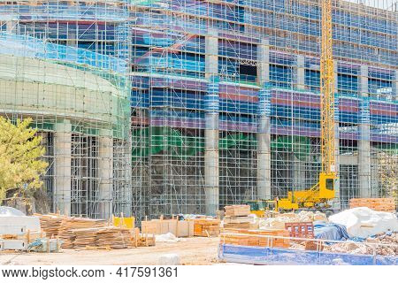 Pyeongtaek, South Korea; April 14, 2021: Building Under Construction Surrounded By Scaffolding And B