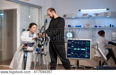 Team Of Medial Researchers Monitoring Vo2 Of Man Sport Performance
