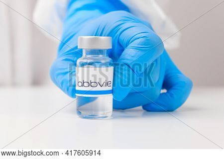 Abbvie Vial Or Bottle With Pharmaceuticals Demonstrated By Health Worker Or Scientist In Rubber Glov
