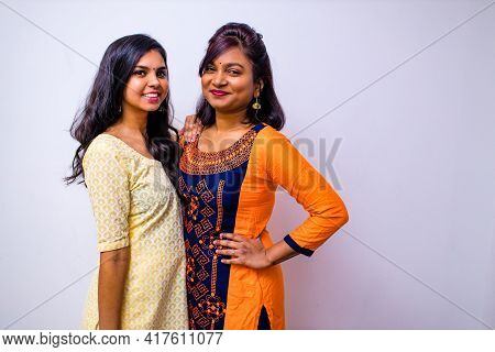 Casual Indian Clothes , Two Indian Woman In Kurta Posing Over White Wall