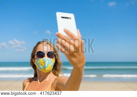 Funny Girl Taking Selfie Photo By Smartphone On Tropical Sea Beach. New Rules To Wear Face Mask At P