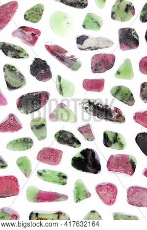 Ruby Zoisite Rare Jewel Stones Texture On Light White Surface Background.