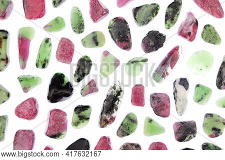 Ruby Zoisite Rare Jewel Stones Texture On Light White Surface Background.