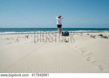 Backpacker Female On The Patara Sand Dunes Beach Enjoying The Windy Mediterranean Sea During Lycian 