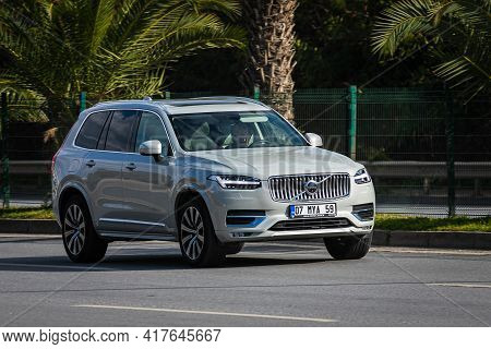Antalya, Turkey - April 12 2021:  White Volvo Xc90 Is Driving Fast On The Street On A Warm Summer Da