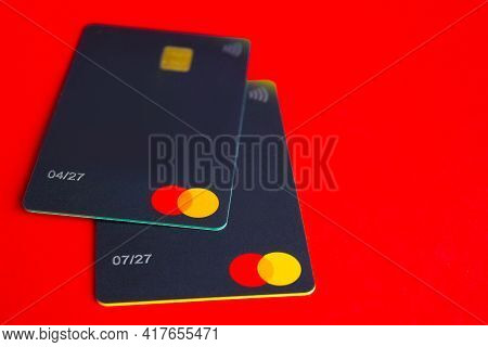 Kyiv, Ukraine - April 18, 2021: Mastercard Credit Card Close Up On Red Background
