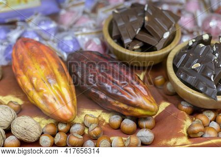 Cocoa Beans And Cocoa Beans. Nearby Chocolate Bars And Nuts. Ingedients Of Sweets