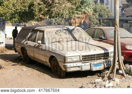 Giza, Egypt - January 26. 2021: Abandoned American Car Chevrolet Caprice Estate In The City Street.