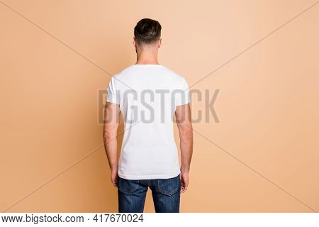 Back Rear View Photo Of Young Brown Hair Man Avoiding Incognito Anonym Isolated Over Beige Color Bac