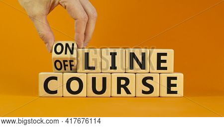 Online Or Offline Course Symbol. Businessman Turns The Cube, Changes Words 'offline Course' To 'onli