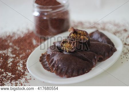 Steamed Dumplings Made From Finger Millet Flour. It Is Stuffed With Coconut And Jaggery To Make It S