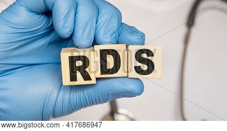 Rds Respiratory Distress Syndrome - Word From Wooden Blocks With Letters Holding By A Doctor's Hands