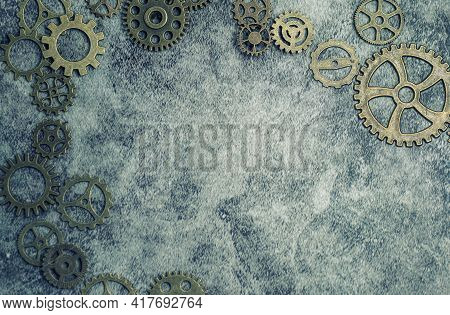 Steampunk Background With Different Sized Cogs And Gears.
