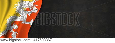 Butane Flag On Concrete Wall. Banner With Fabric Texture Of The Flag Of Butane.