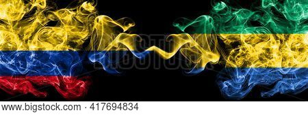 Colombia, Colombian Vs Gabon, Gabonese, Gabonian Smoky Mystic Flags Placed Side By Side. Thick Color