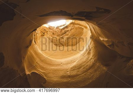 Bell Caves interior opening at the top in Bet Guvrin, Israel.