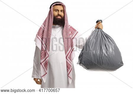 Young saudi arab man holding a plastic waste bag isolated on white background