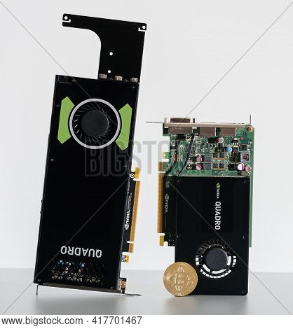 Paris, France - Aug 23, 2017: Detail Of Ngold Bitcoin Coin And New Professional Nvidia Quadro K2200 