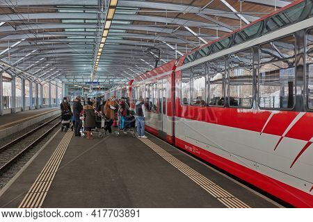 Tasch, Switzerland - Circa 2021: Train on Zermatt Shuttle line in the Swiss Alps arriving to the station. This famous mountain resort town is not accesible by car for ecological reasons.