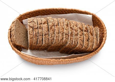 sliced rye bread in a wicker basket, isolated on a white background