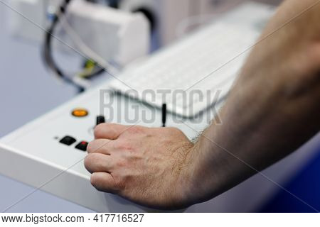 Machine Tool Operator Working With Computer-operated Equipment. Selective Focus.