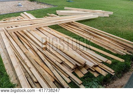 Pile Of Wooden Boards In The Sawmill, Planking. Wood Lumber Stack. Construction From Ecological Mate