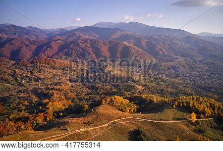 aerial view of Carpathian mountains countryside in autumn morning, Romania