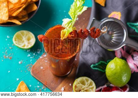 Mexican Alcohol Cocktail Clamato Beer With Shrimps And Celery Stick