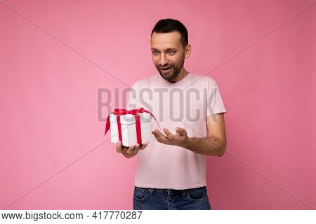 Shot Of Handsome Happy Surprised Brunet Young Man With Beard Isolated Over Pink Background Wall Wear