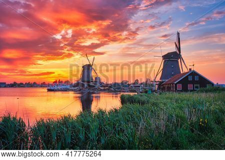 Windmills at Zaanse Schans in Holland on sunset. Zaandam, Nether