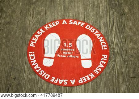 Dubbo, Australia 20201-04 Covid-19. Sticker On The Floor About Social Distancing. Please Keep A Safe