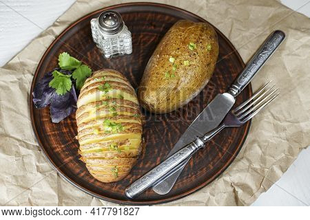 Baked Potatoes In The Skin On A Plate